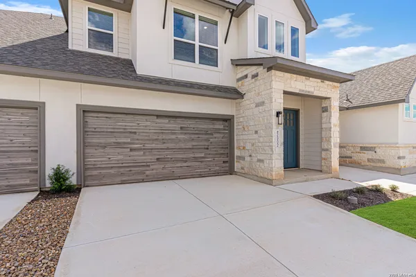 a view of a brick house with a yard