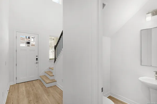 a living room with furniture and a painting on the wall