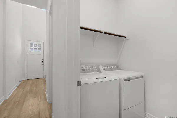a utility room with dryer and washer