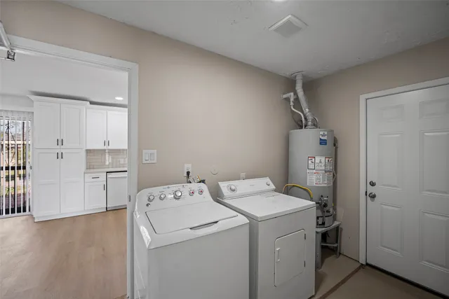 a view of storage and utility room with washer and dryer