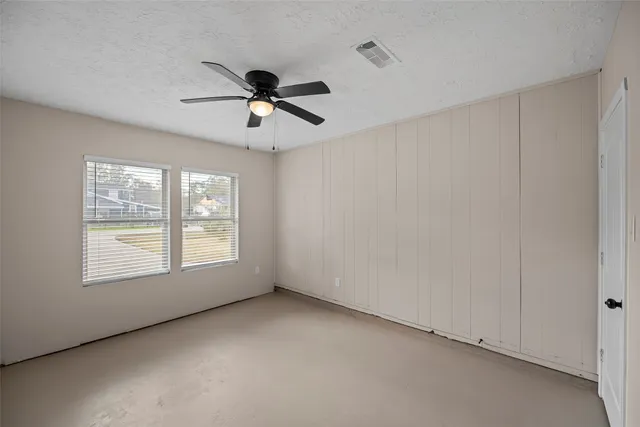 a view of empty room with windows
