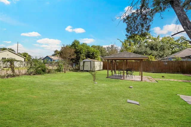 a backyard of a house with lots of green space
