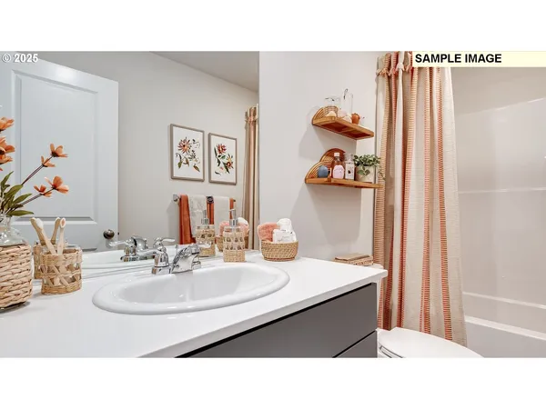 a bathroom with a sink double vanity and a mirror