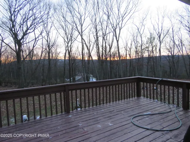 a kitchen with a refrigerator and a sink