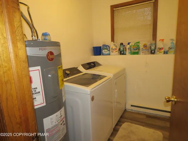a bathroom with a toilet and a shower curtain