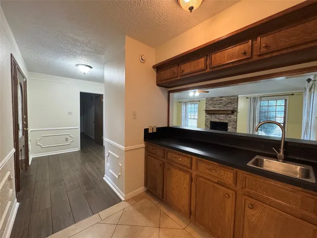 a kitchen with a sink and cabinets
