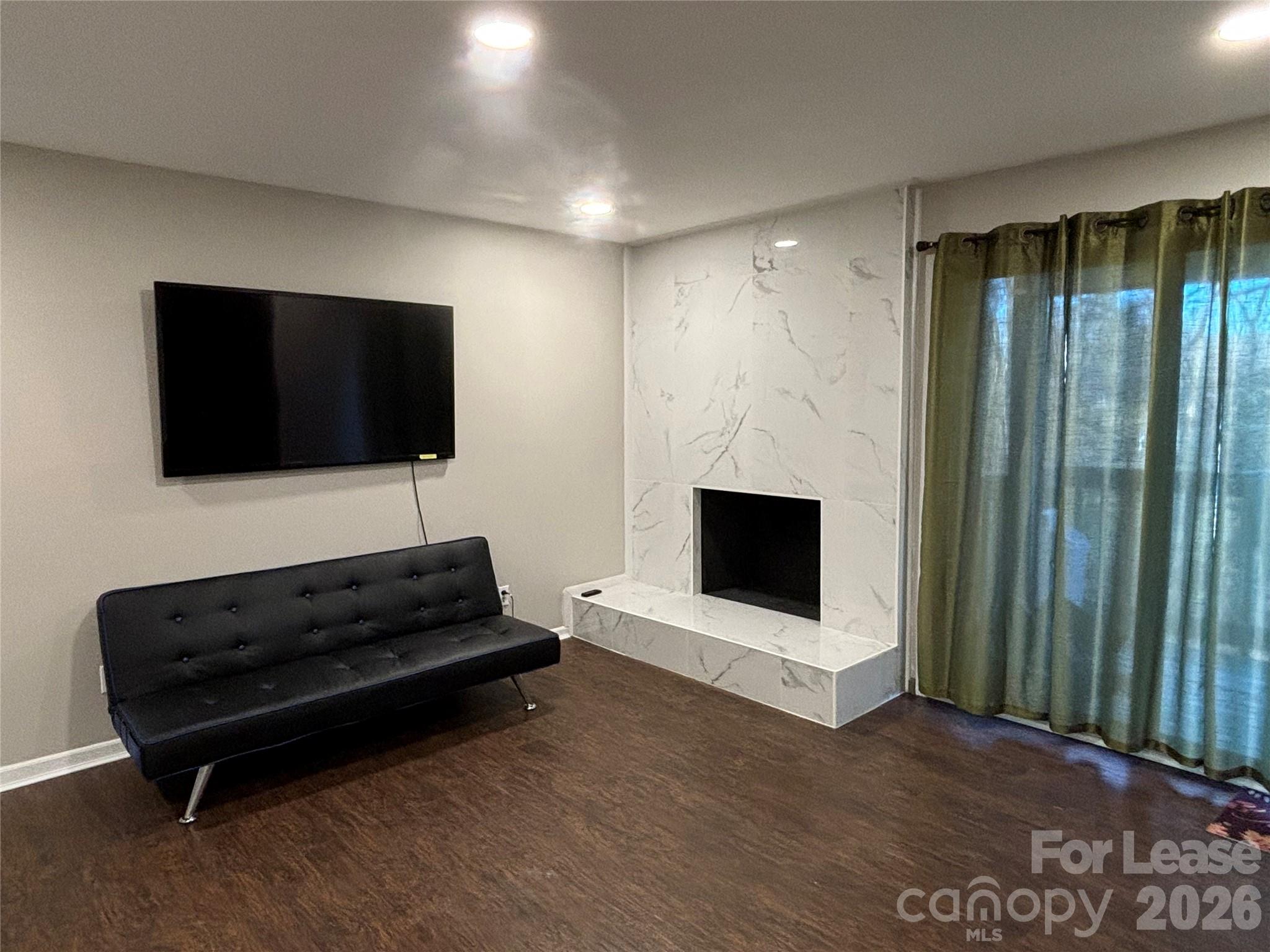 11040 Harrowfield Road Charlotte, NC 28226 - Photo 6 of 14 a living room with furniture and a flat screen tv