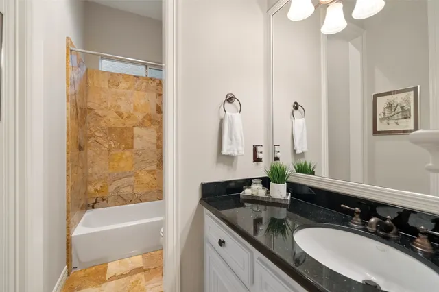 a balcony with furniture and a floor to ceiling window