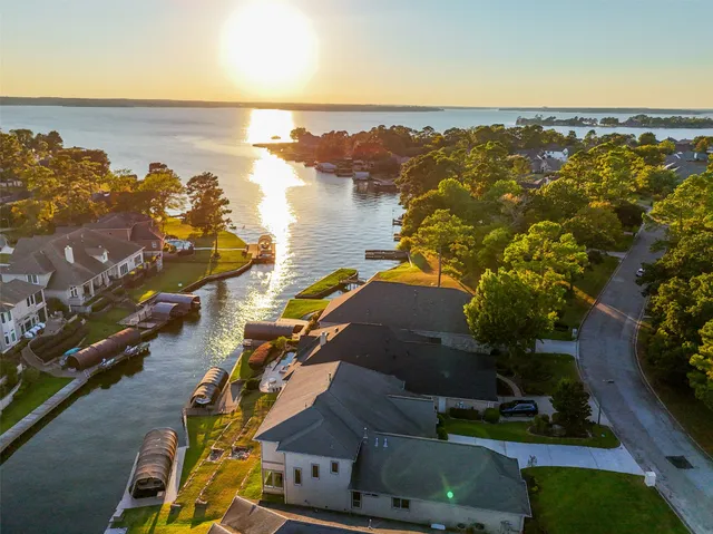 an aerial view of a house with a ocean view