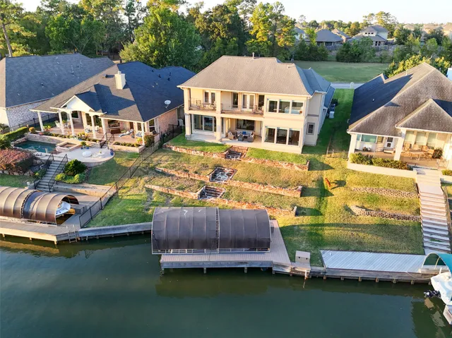 an aerial view of a house with swimming pool