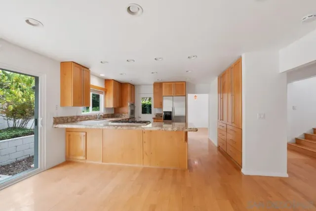 a view of a porch with furniture and floor to ceiling window