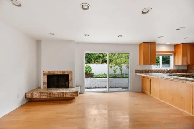 a view of an empty room and a window