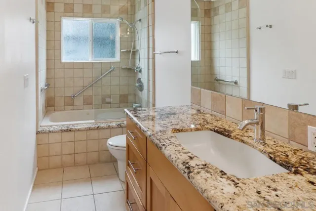 a front view of a house with yard and garage