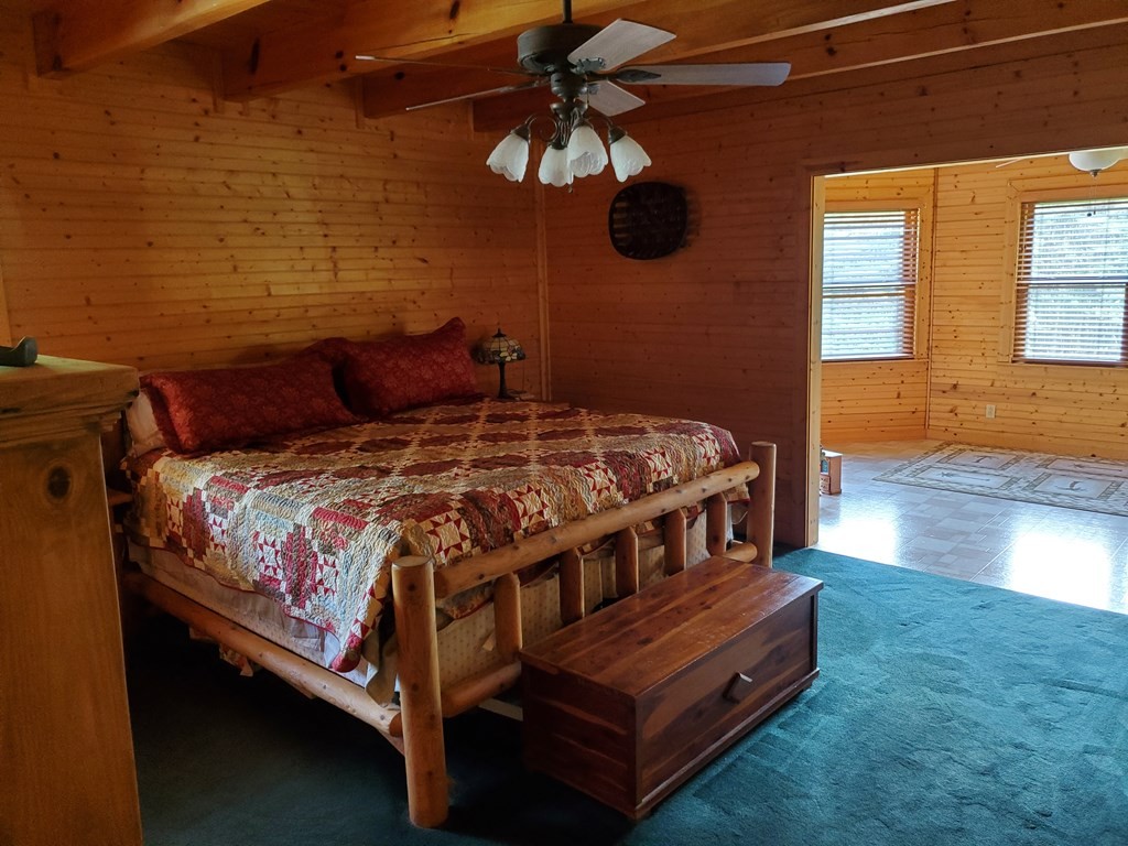 146 Sparkman Town Road Rock Island, TN 38581 - Photo 7 of 60 a bedroom with a bed and wooden floor