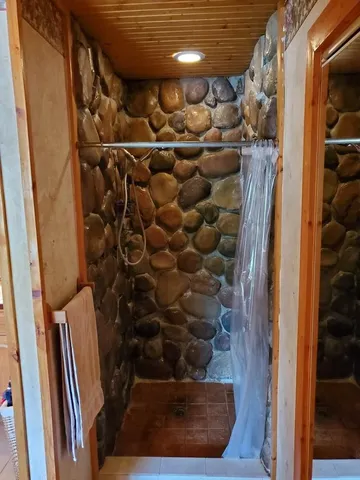 a backyard of a house with table and chairs