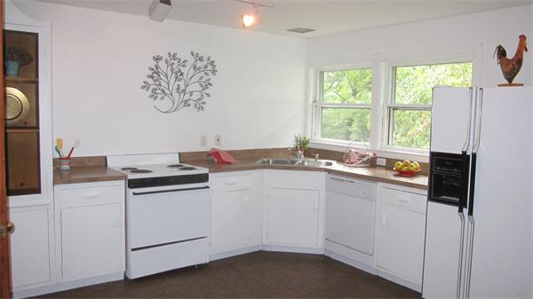 65 Williams Road Concord, MA 01742 - Photo 12 of 15 a kitchen with a stove and a refrigerator