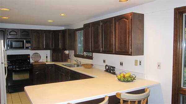65 Williams Road Concord, MA 01742 - Photo 2 of 15 a kitchen with granite countertop a sink a stove and cabinets