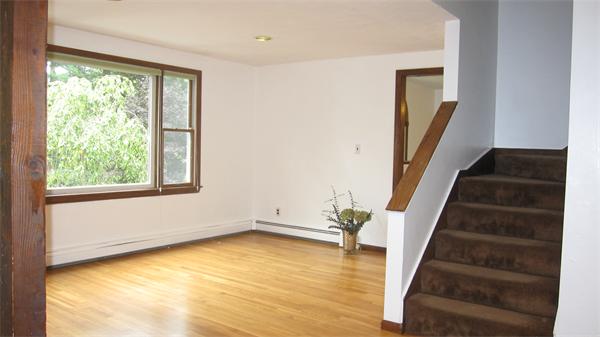 65 Williams Road Concord, MA 01742 - Photo 8 of 15 a view of an empty room with wooden floor and a window