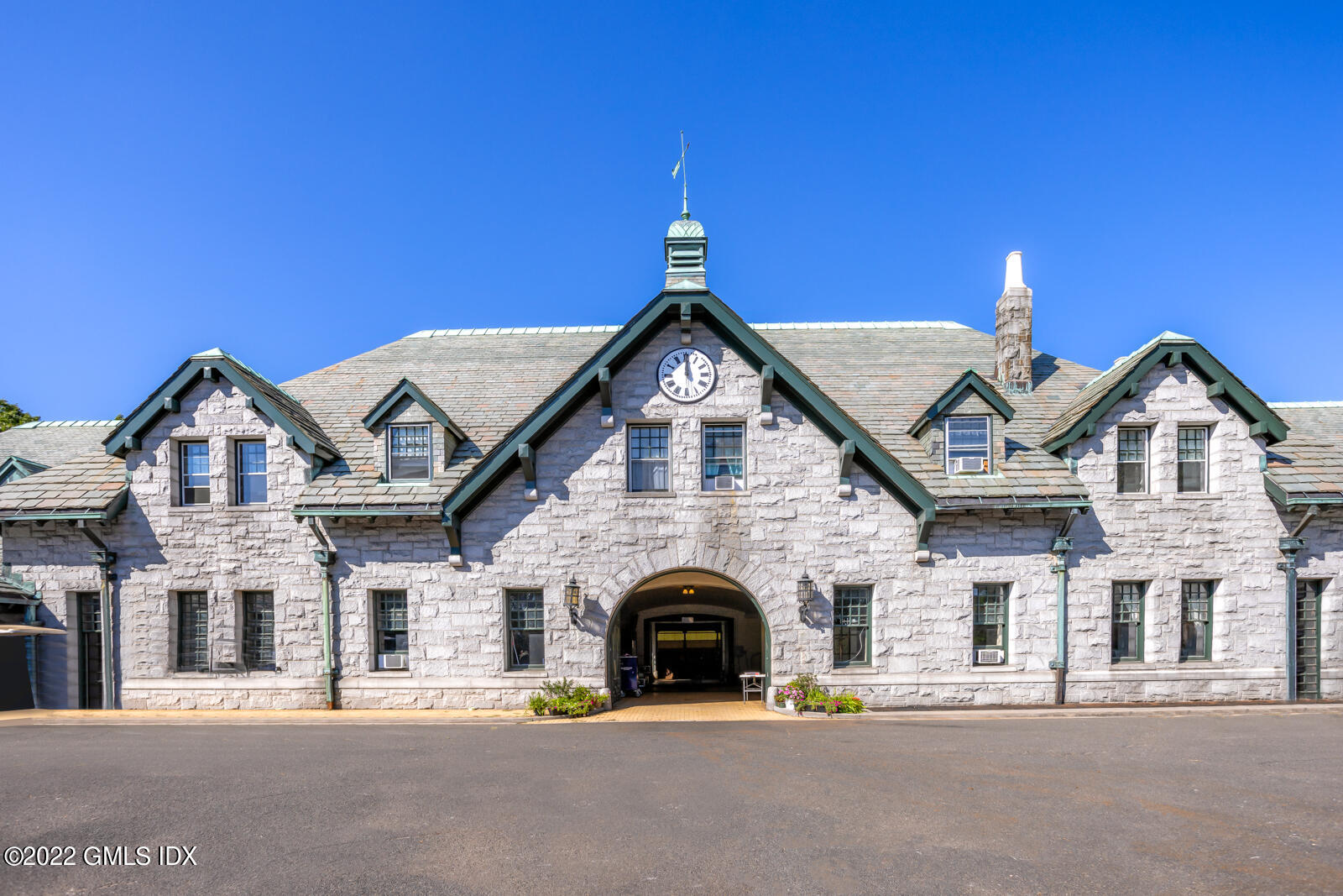 Great Island Darien, CT 06820 - Photo 8 of 16 a view of a brick house with large windows