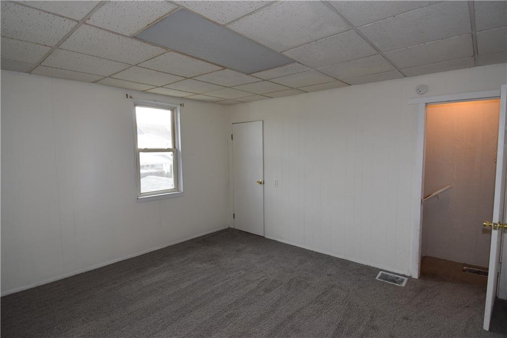 69 Orchard Street McKees Rocks, PA 15136 - Photo 14 of 14 an empty room with a empty space and windows