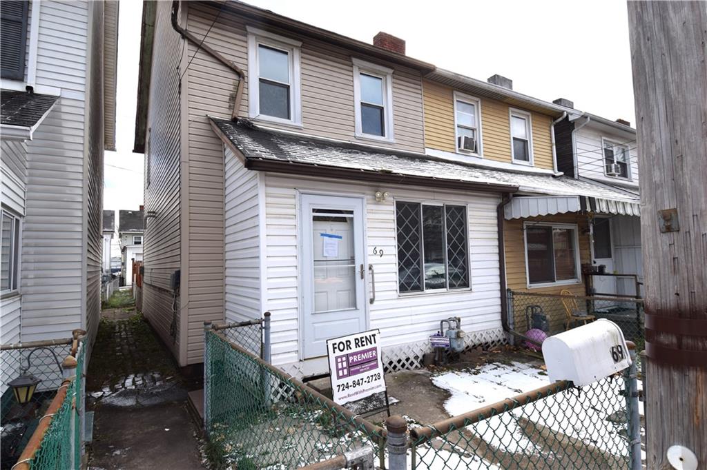 69 Orchard Street McKees Rocks, PA 15136 - Photo 2 of 14 front view of a house with two chairs and a rug