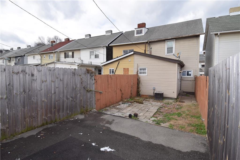 69 Orchard Street McKees Rocks, PA 15136 - Photo 10 of 14 a view of a small white house