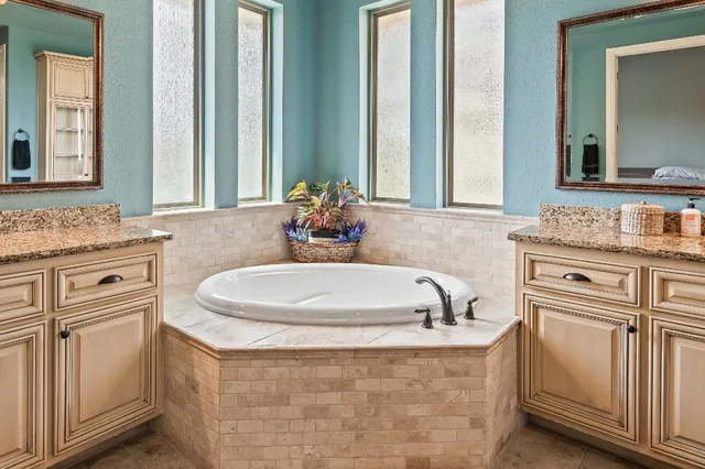 a spacious bedroom with a bed and a couch