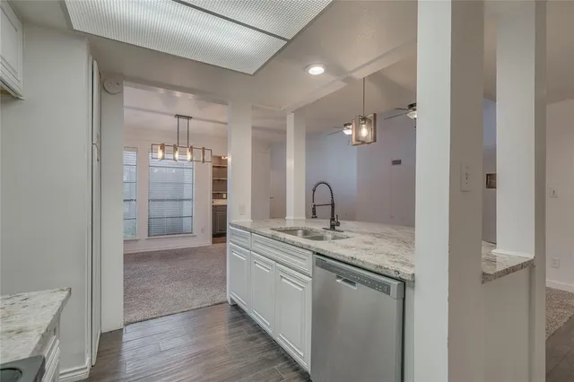 a kitchen with a sink and cabinets