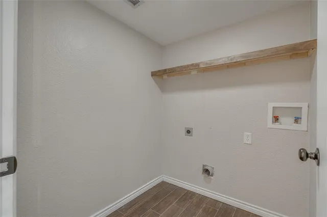 a view of an empty room with a fan