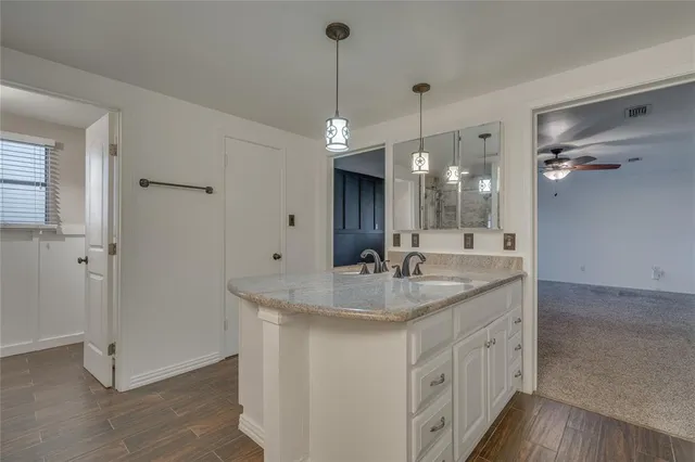 a view of balcony with wooden floor