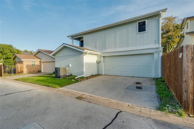 a view of a park with large trees