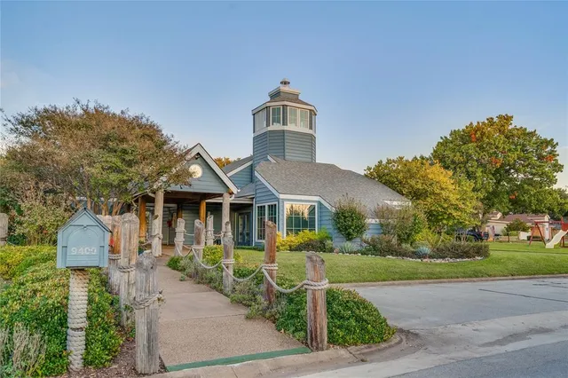 a view of a swimming pool with sitting area and furniture