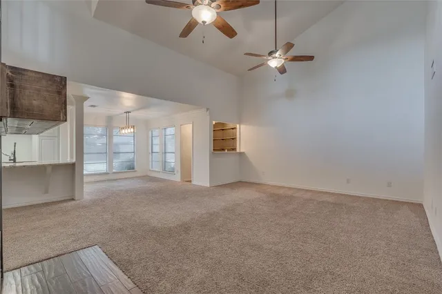 a view of a livingroom with a fireplace and window