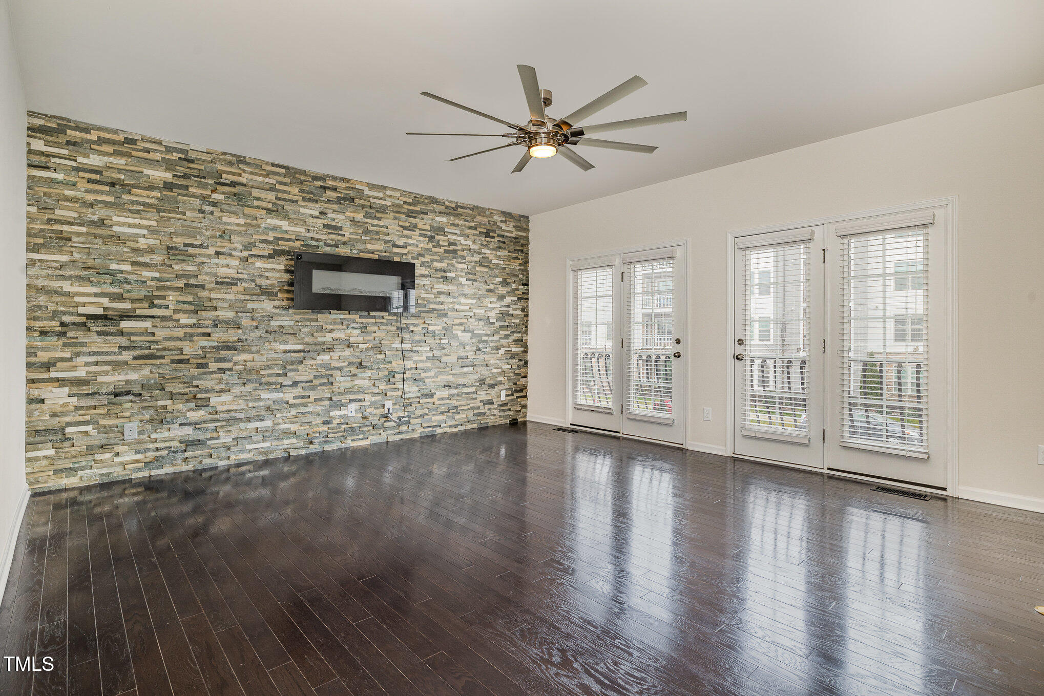 7002 Reedybrook Crossing Apex, NC 27523 - Photo 3 of 27 Living Room with Electric Fireplace and Feature Wall