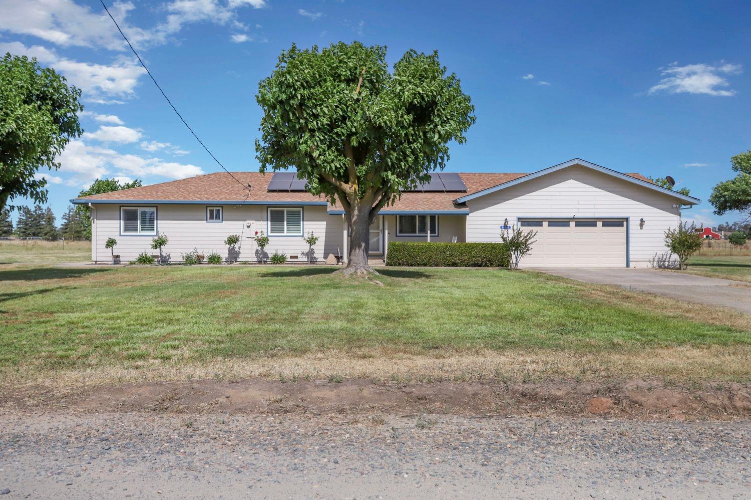 24770 Fuhrman Road Acampo, CA 95220 - Photo 1 of 1 a front view of a house with garden