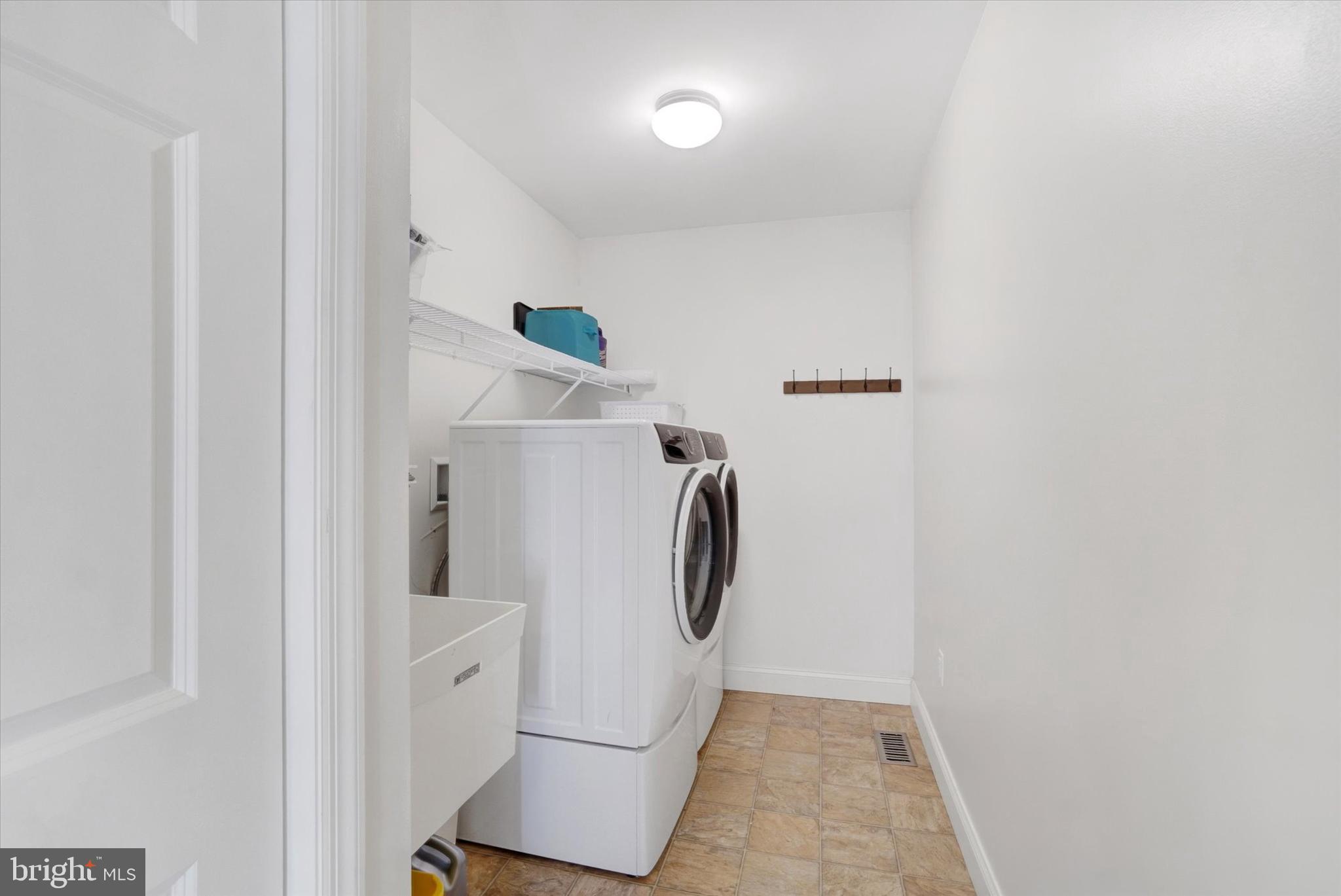 657 Campbell Road York, PA 17402 - Photo 18 of 30 a utility room with dryer and washer