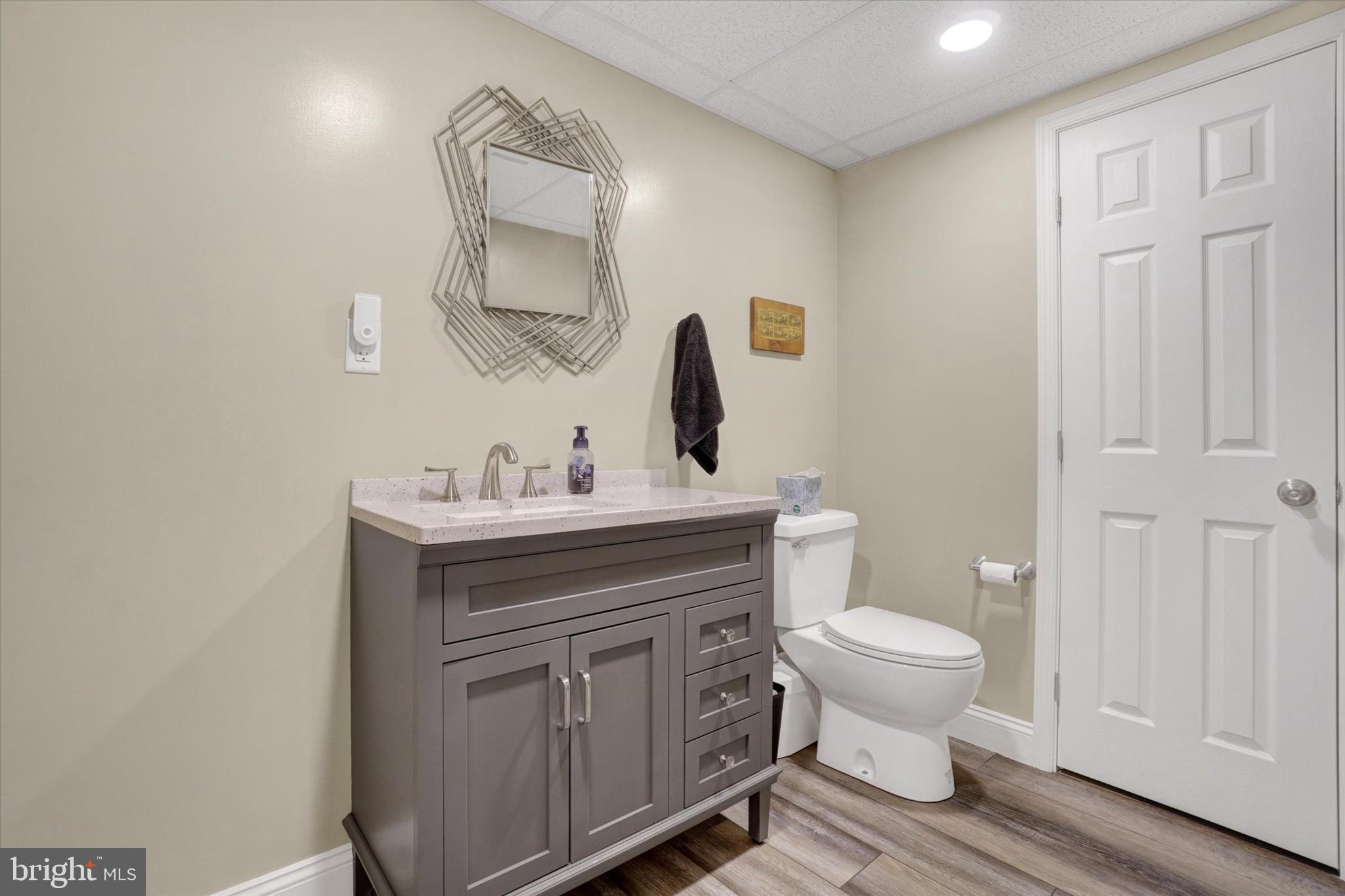 657 Campbell Road York, PA 17402 - Photo 22 of 30 a bathroom with a toilet a sink a mirror and vanity