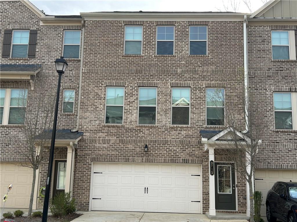 a front view of a house with yard