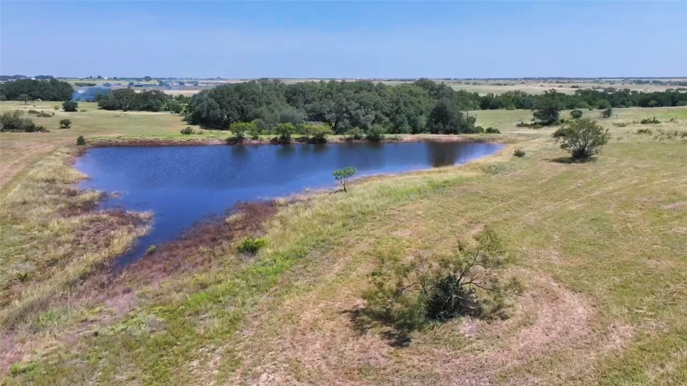 276 County Road 276 Bertram, TX 78605 - Photo 17 of 23 a view of a lake with beach and city view