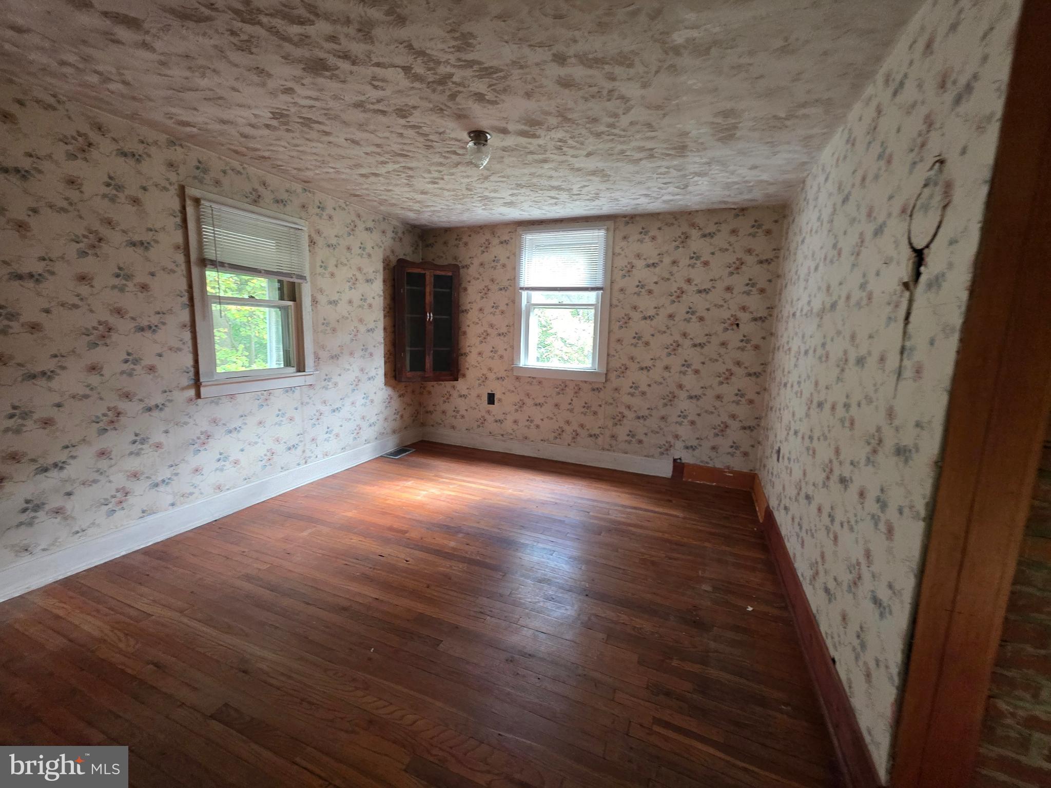 24984 Forrest Cove Way Hollywood, MD 20636 - Photo 4 of 10 an empty room with windows