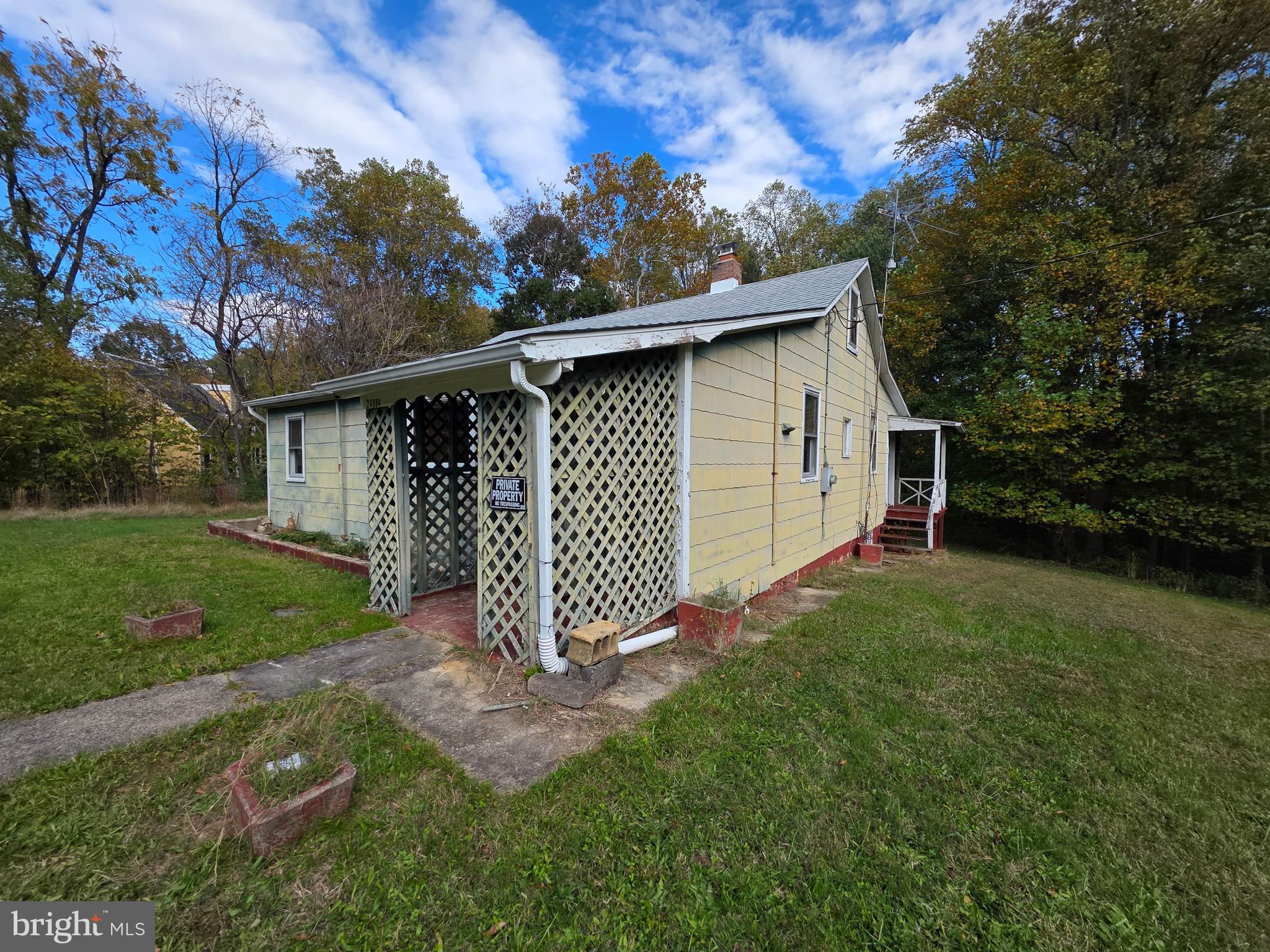 24984 Forrest Cove Way Hollywood, MD 20636 - Photo 7 of 10 a view of backyard with wooden fence and large trees