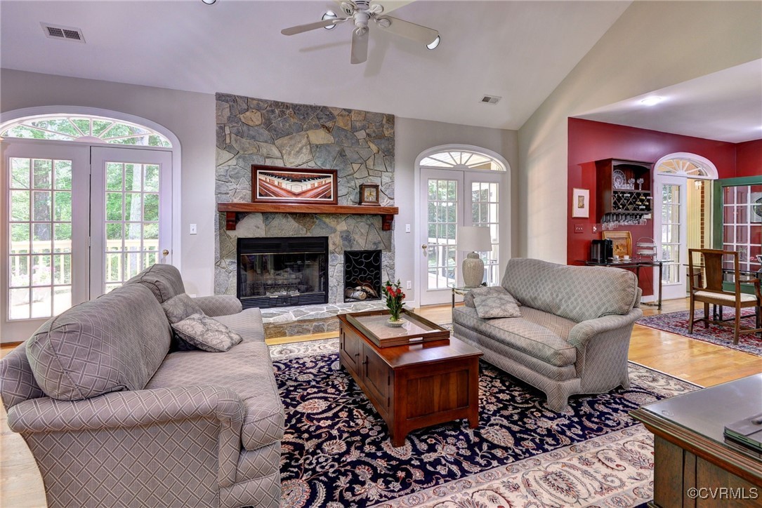 7 Hague Close Williamsburg, VA 23185 - Photo 11 of 50 a living room with furniture a fireplace and a large window