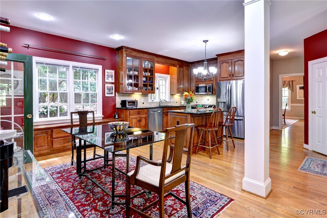 7 Hague Close Williamsburg, VA 23185 - Photo 14 of 50 a view of a dining room with furniture window and wooden floor