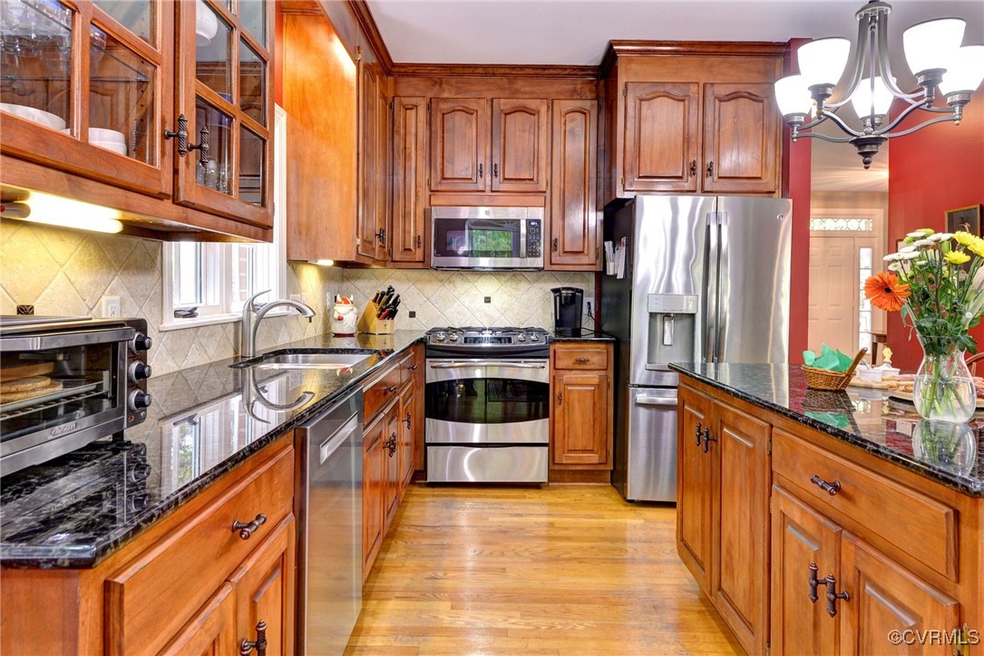 7 Hague Close Williamsburg, VA 23185 - Photo 19 of 50 a kitchen with stainless steel appliances granite countertop a refrigerator a stove and a sink