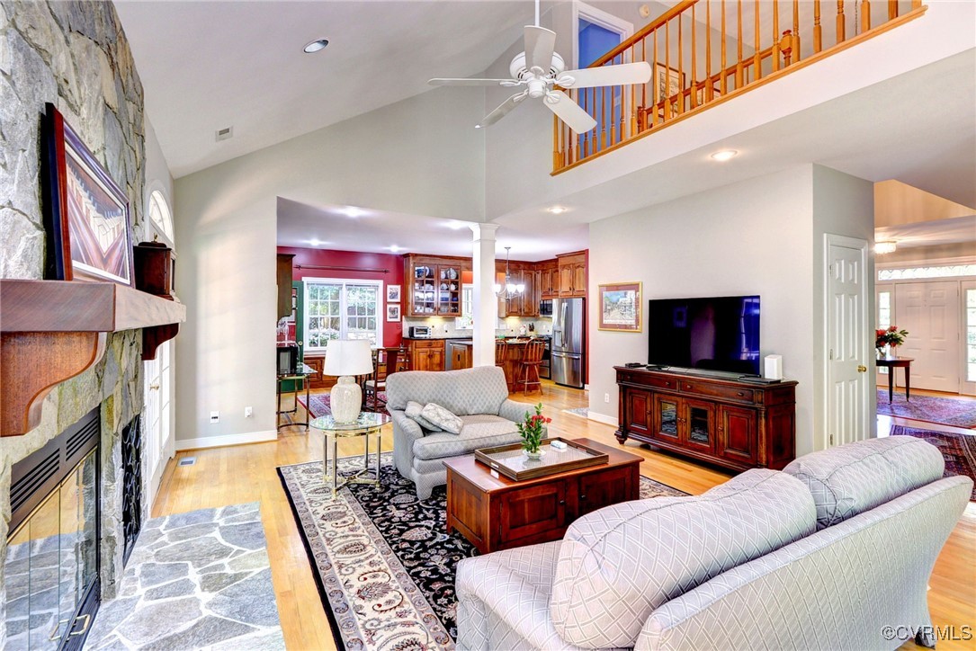 7 Hague Close Williamsburg, VA 23185 - Photo 20 of 50 a living room with furniture a flat screen tv and a fireplace