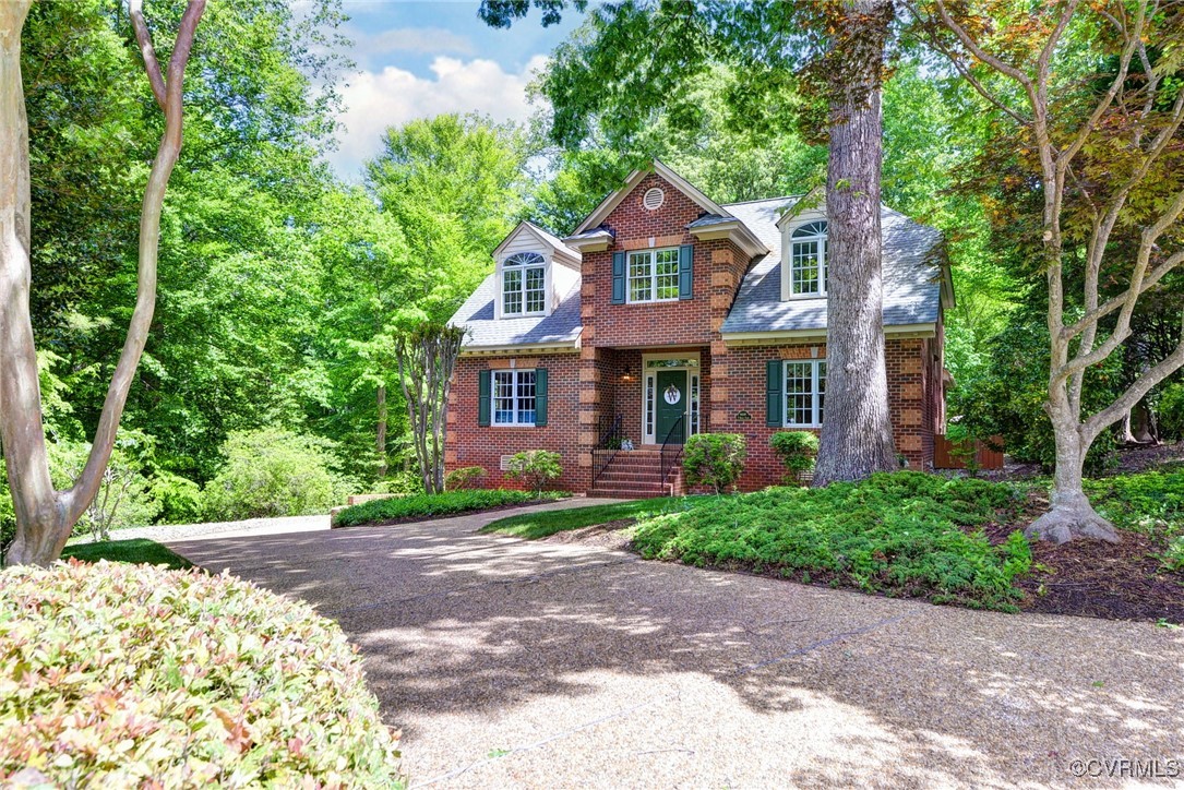 7 Hague Close Williamsburg, VA 23185 - Photo 2 of 50 a front view of a house with garden