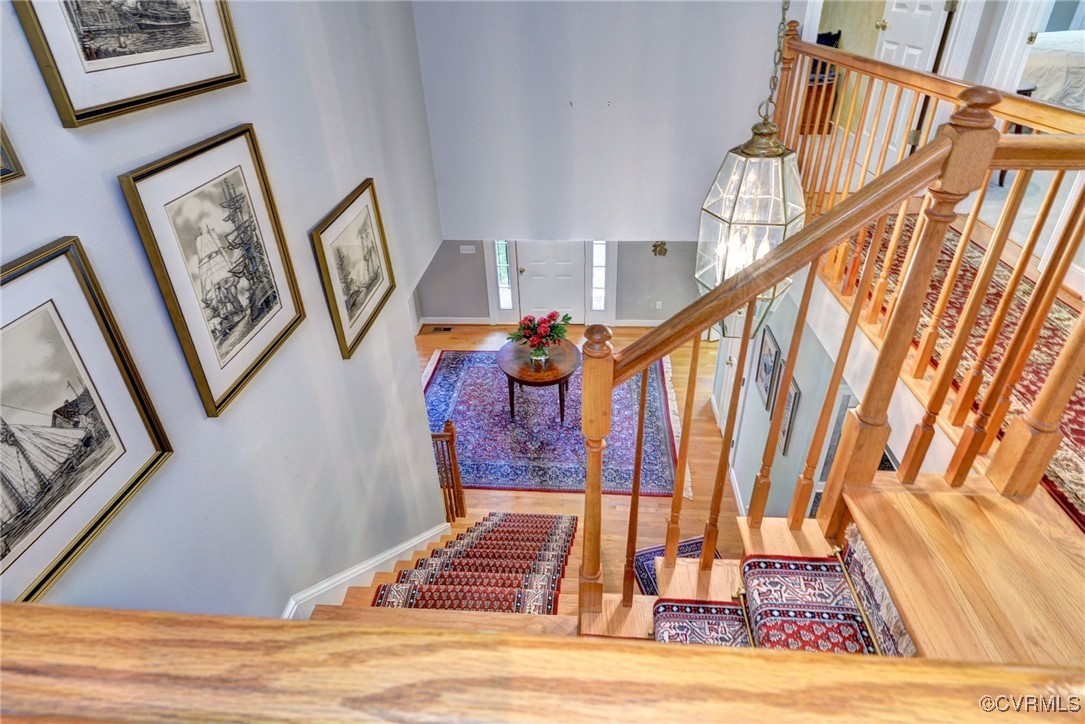 7 Hague Close Williamsburg, VA 23185 - Photo 28 of 50 a view of staircase with white walls and a rug