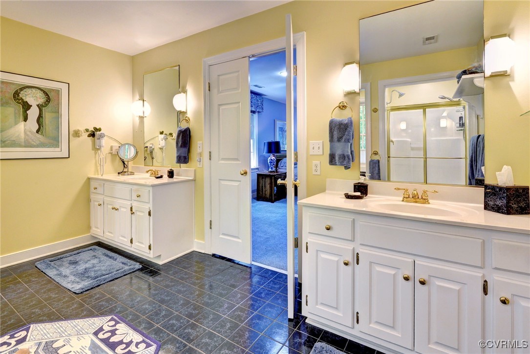 7 Hague Close Williamsburg, VA 23185 - Photo 33 of 50 a spacious bathroom with a double vanity sink and a mirror