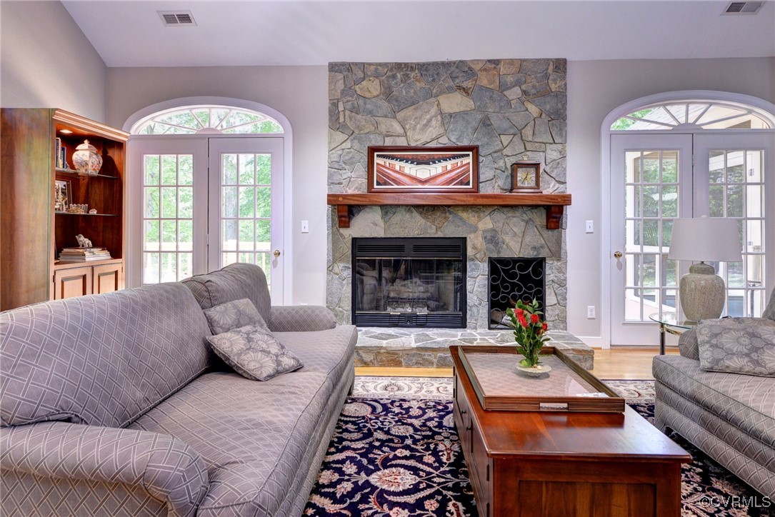 7 Hague Close Williamsburg, VA 23185 - Photo 41 of 50 a living room with furniture a large window and a fireplace