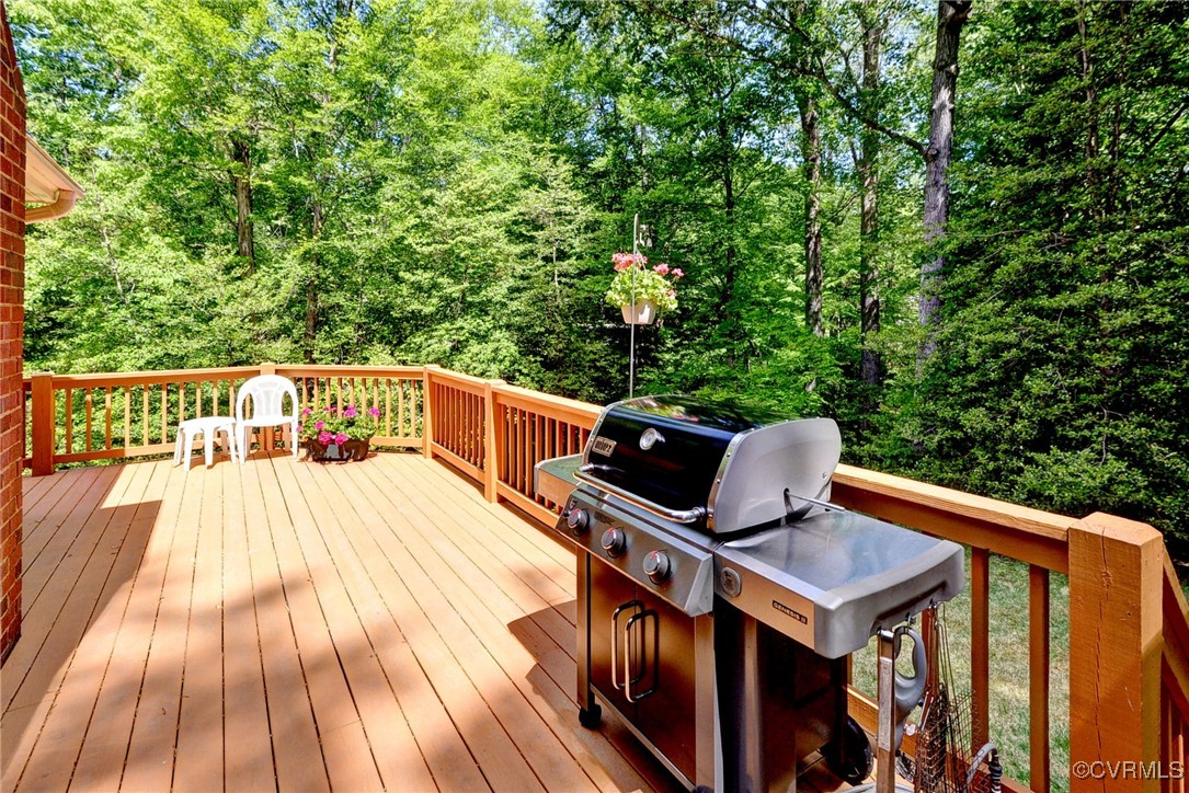 7 Hague Close Williamsburg, VA 23185 - Photo 42 of 50 a view of balcony with wooden floor and outdoor seating